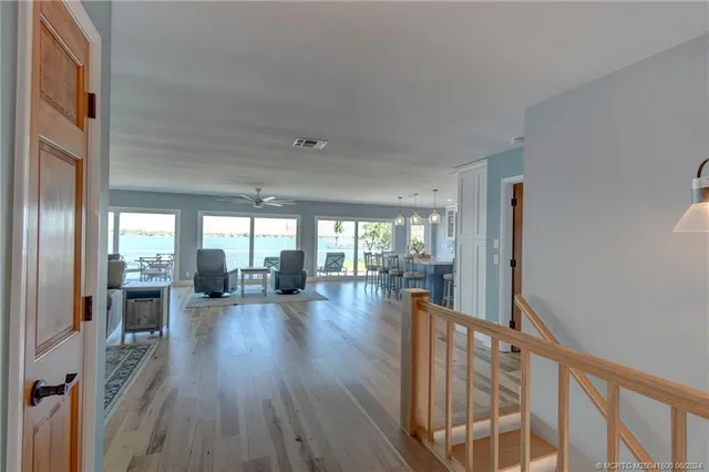a view of a living room and hardwood floor