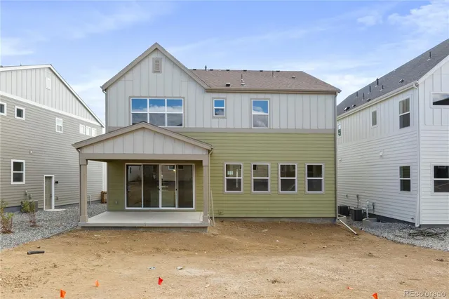 a bathroom with a sink a mirror a toilet and shower