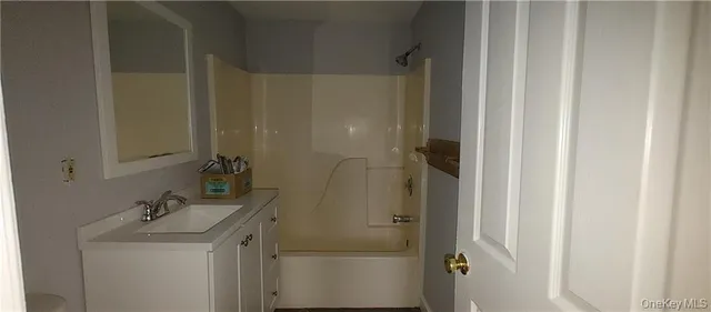 a bathroom with a sink and shower
