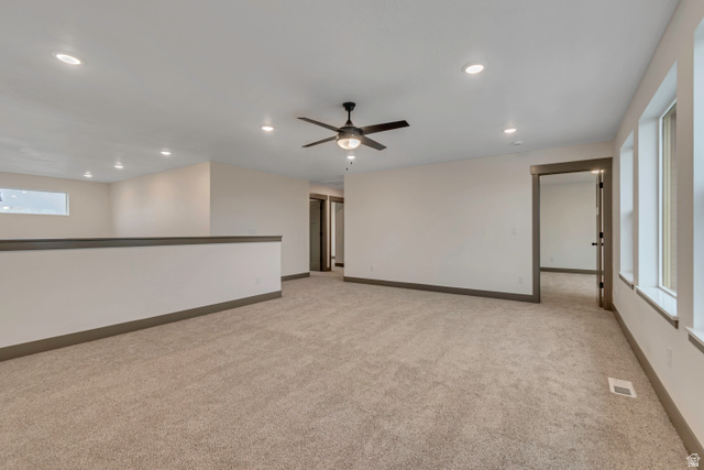 3317 South 1000 West, Unit 6010 Logan, UT 84321 - Photo 23 of 34 Empty room featuring recessed lighting, ceiling fan, and light colored carpet