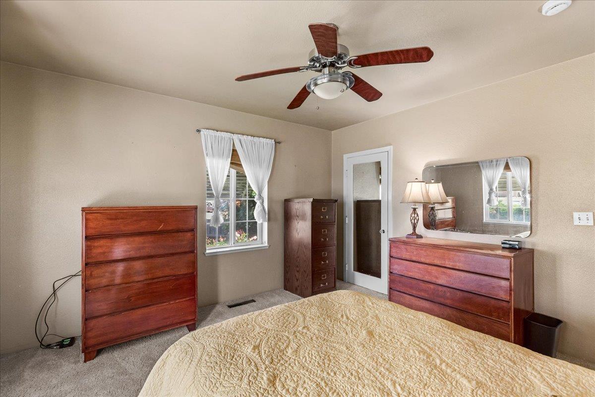 4701 Lone Tree Road Valley Home, CA 95361 - Photo 38 of 59 a bedroom with a bed and a dresser
