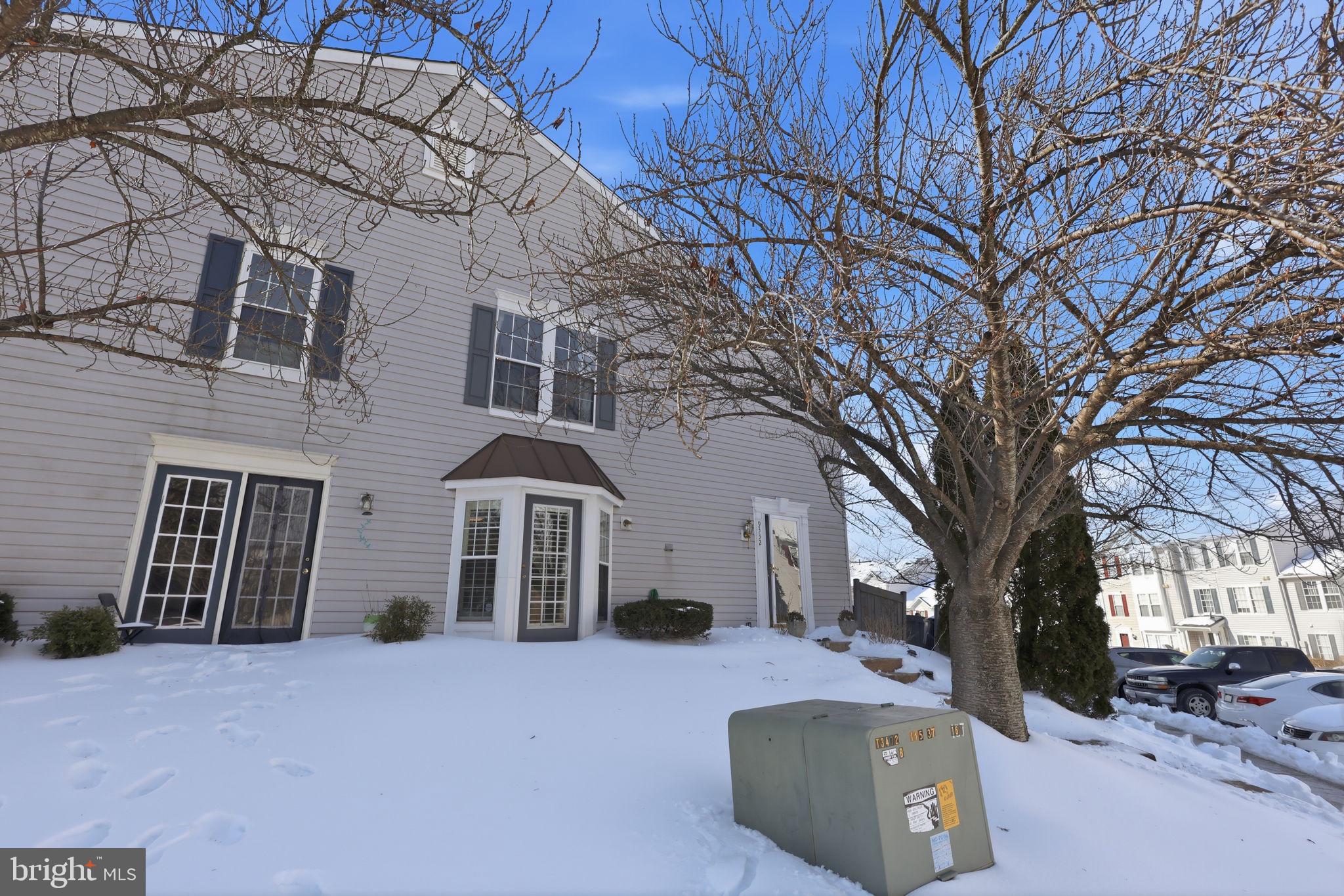 9332 Wax Myrtle Way Manassas, VA 20110 - Photo 3 of 40 a front view of a house with a yard