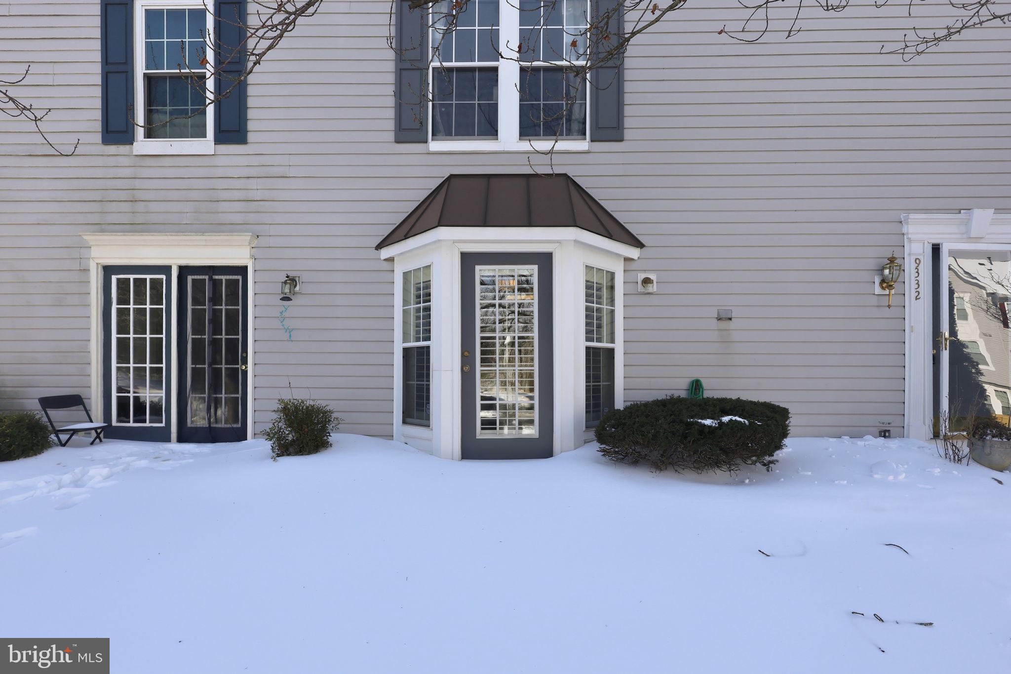 9332 Wax Myrtle Way Manassas, VA 20110 - Photo 4 of 40 a front view of a house with many windows