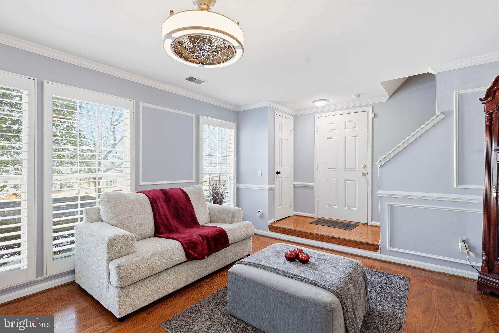 9332 Wax Myrtle Way Manassas, VA 20110 - Photo 9 of 40 a living room with furniture and a window