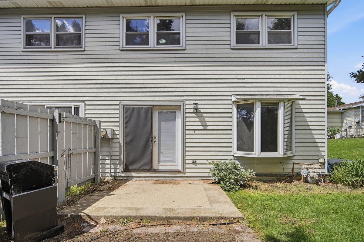 1532 Hunt Drive, Unit A Normal, IL 61761 - Photo 23 of 25 a view of a house with a yard