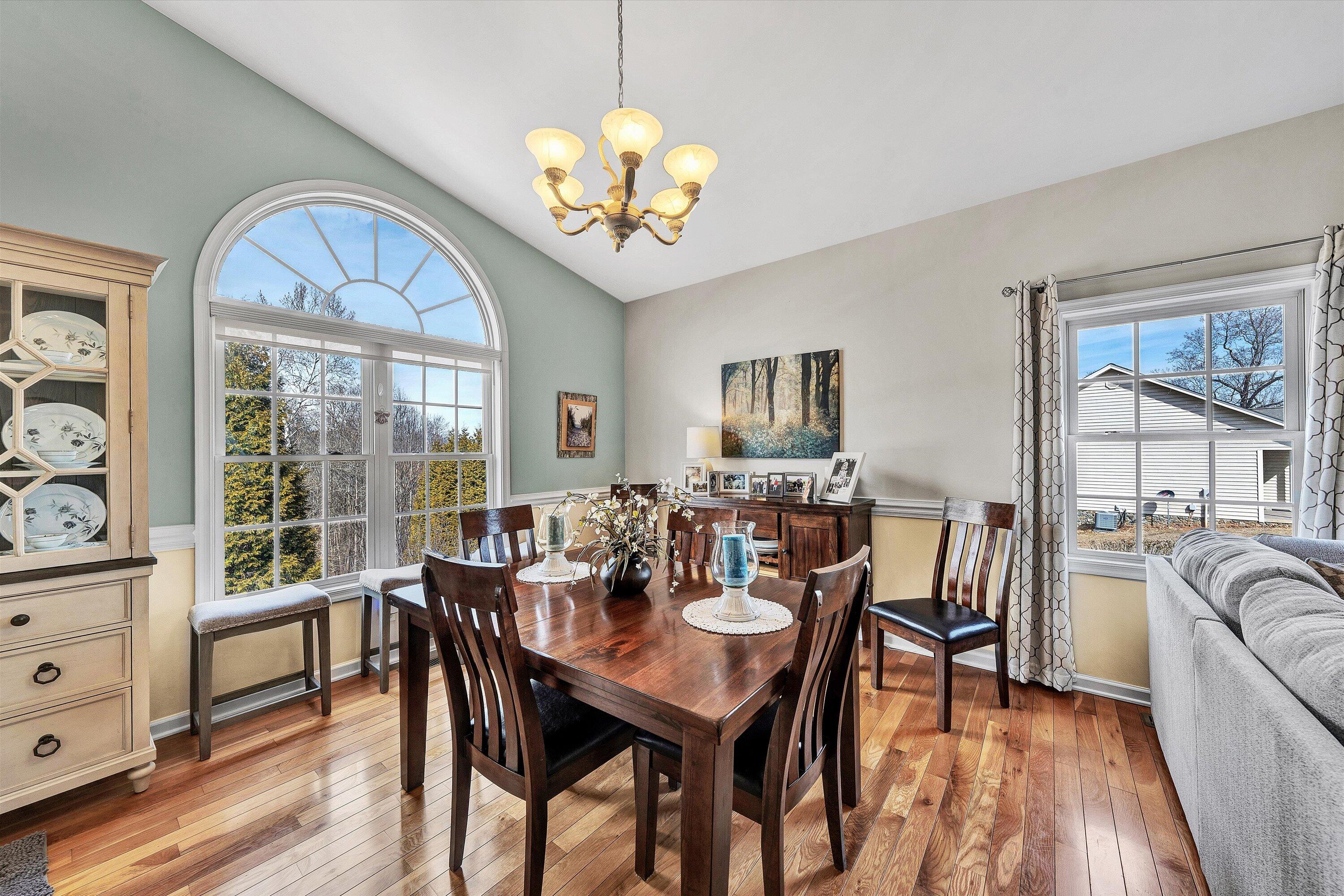 1615 Morewood Road Hardy, VA 24101 - Photo 11 of 46 a view of a dining room with furniture a chandelier and wooden floor