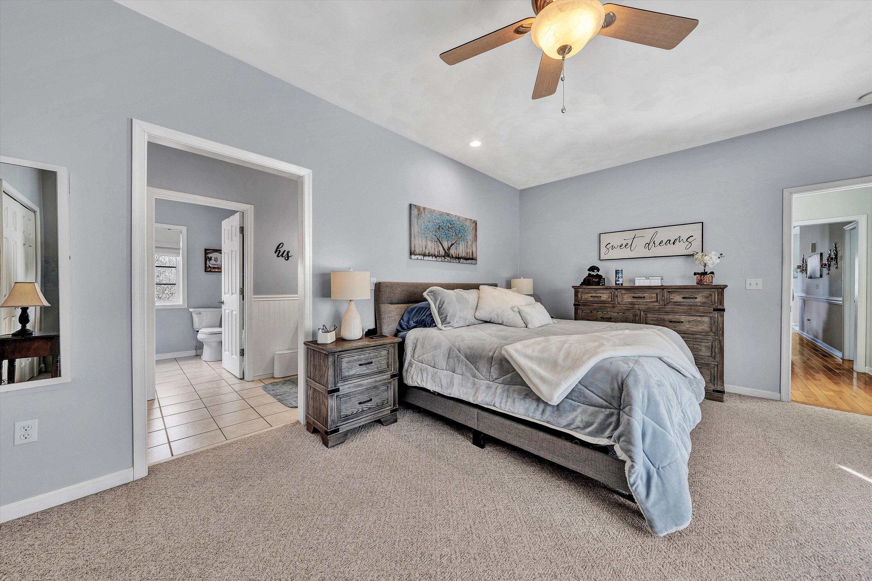 1615 Morewood Road Hardy, VA 24101 - Photo 21 of 46 a spacious bedroom with a bed and ceiling fan