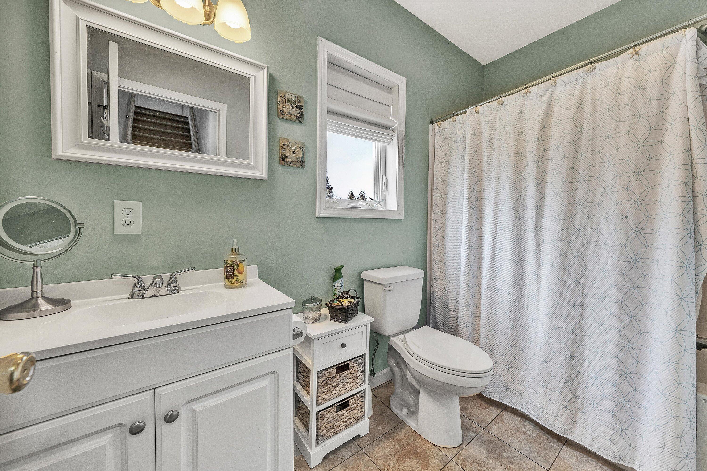 1615 Morewood Road Hardy, VA 24101 - Photo 29 of 46 a bathroom with a toilet sink and mirror