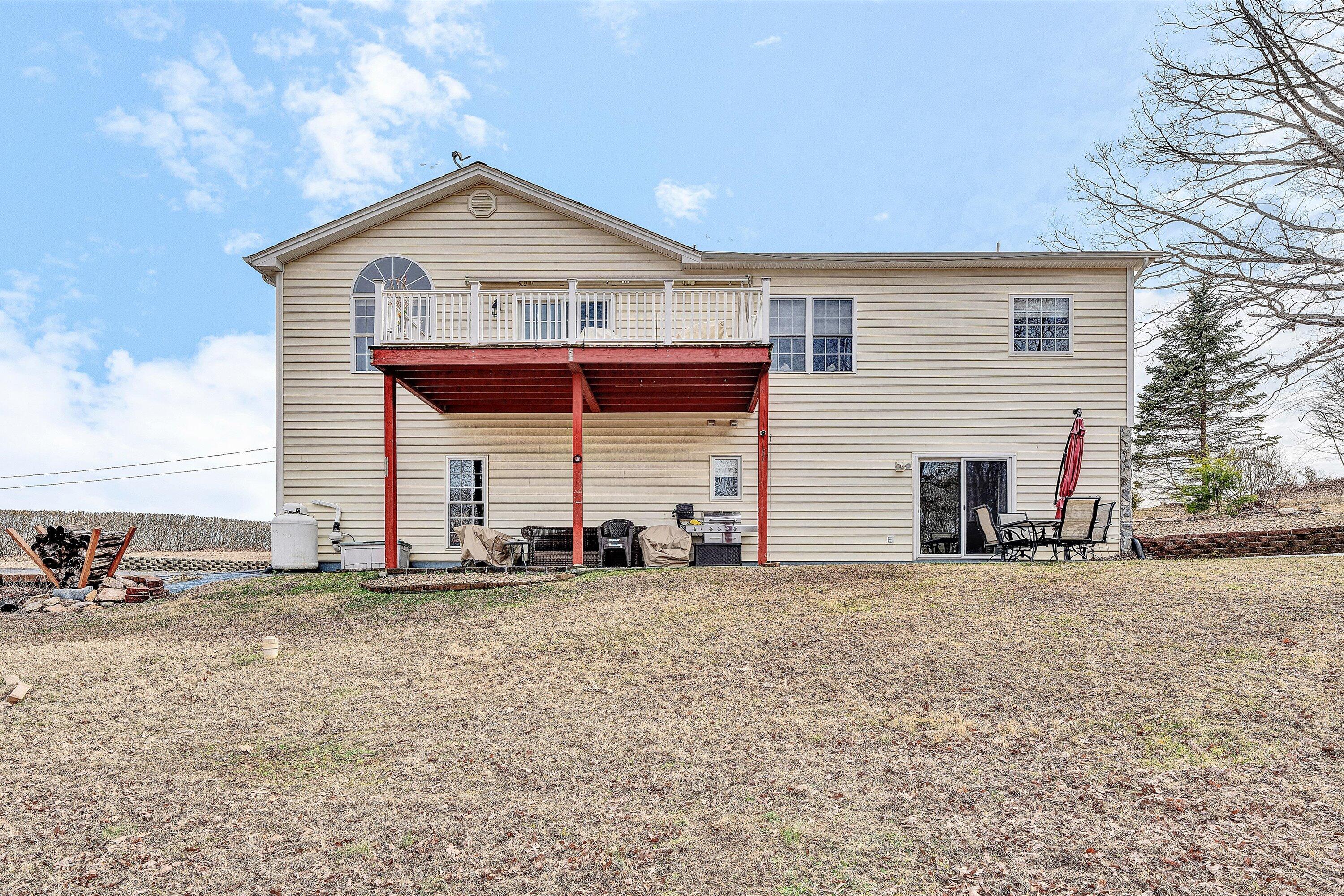 1615 Morewood Road Hardy, VA 24101 - Photo 40 of 46 a view of a house with a patio and a yard