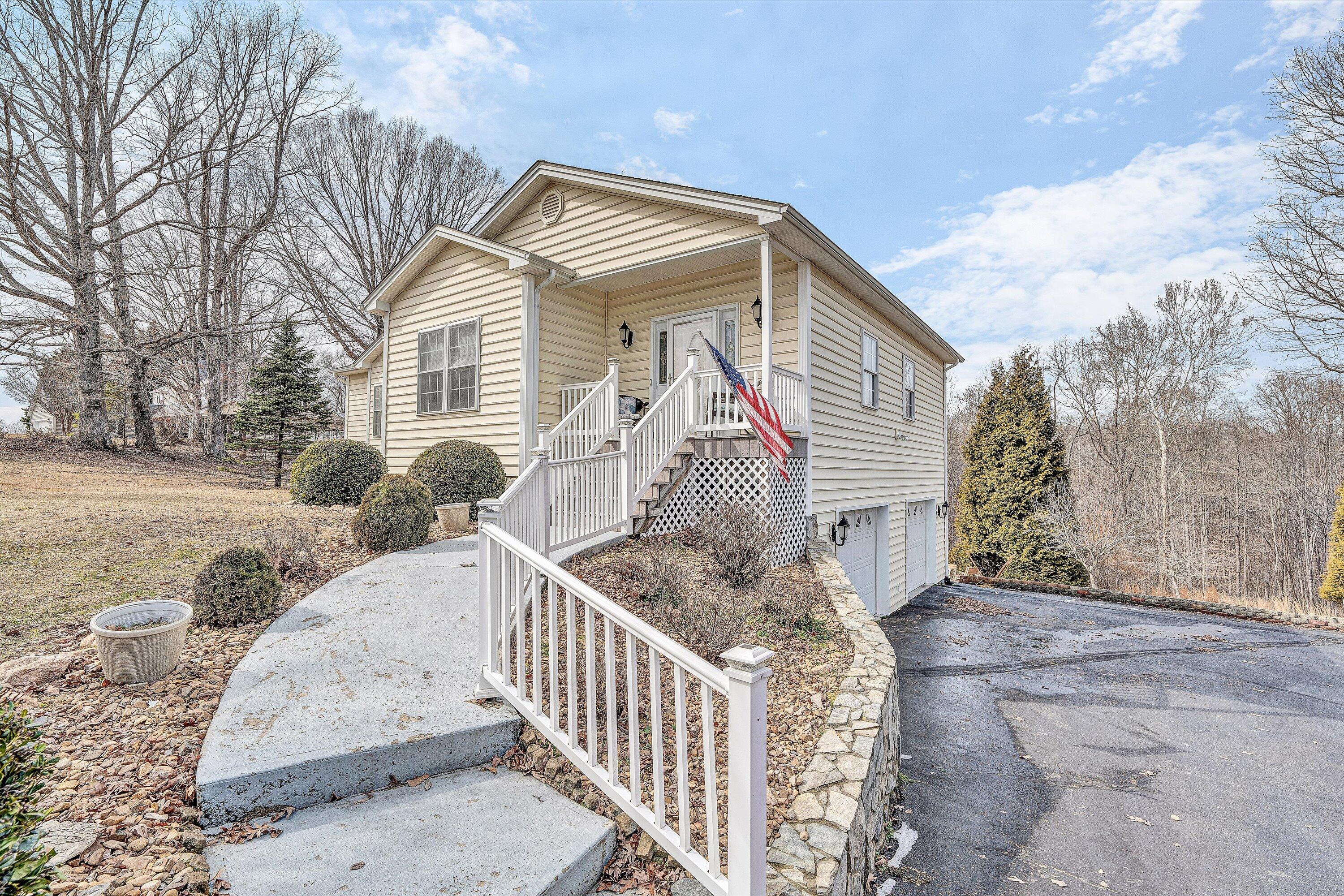 1615 Morewood Road Hardy, VA 24101 - Photo 4 of 46 a view of a house with a small yard and wooden fence