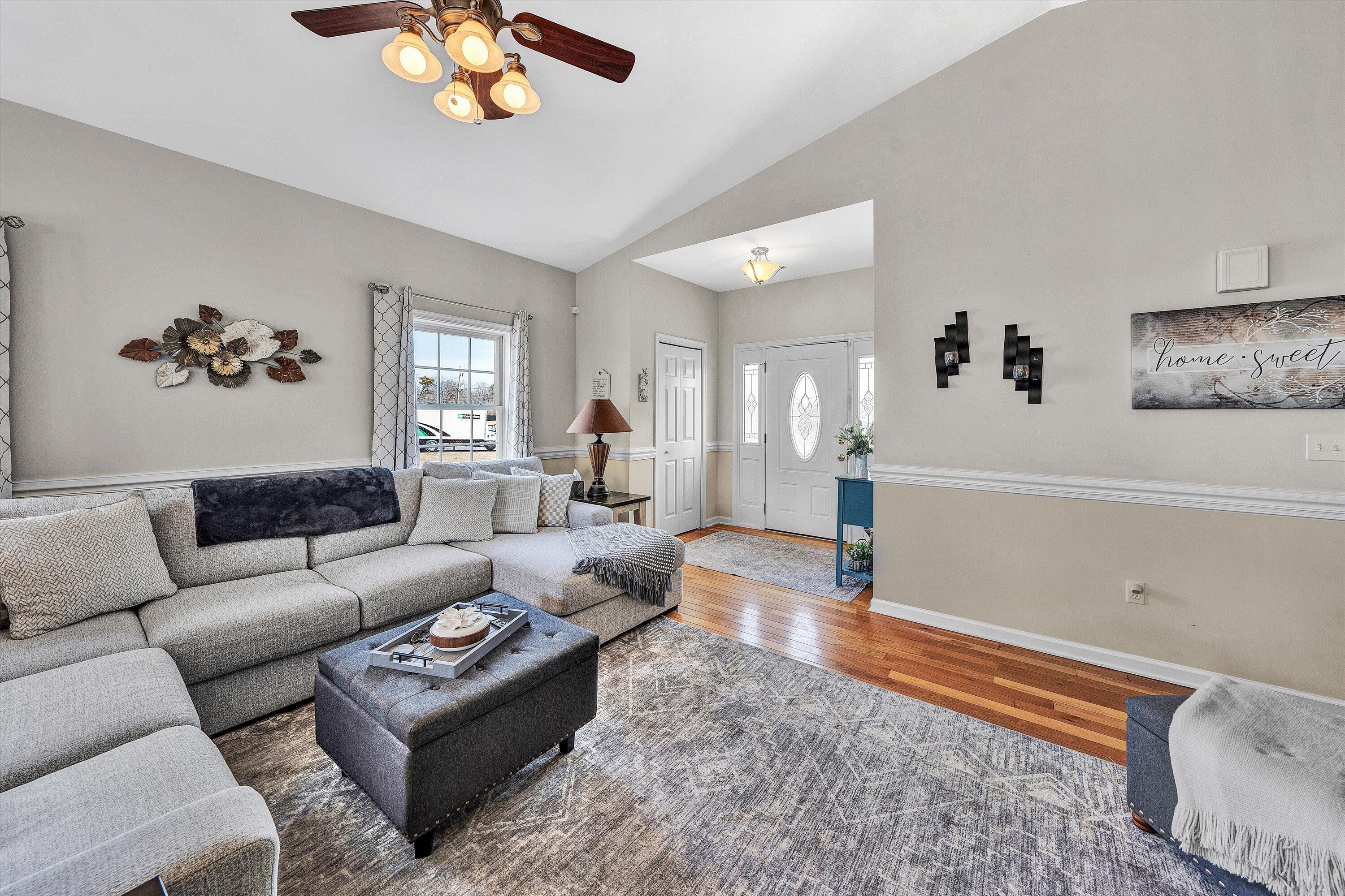 1615 Morewood Road Hardy, VA 24101 - Photo 9 of 46 a living room with furniture a rug and a chandelier
