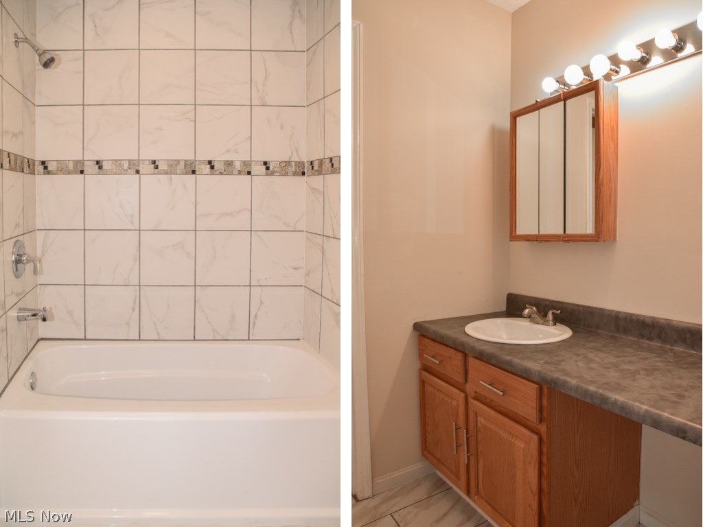 3837 Martha Road Kent, OH 44240 - Photo 14 of 22 Main full bath with tile flooring and shower surround.