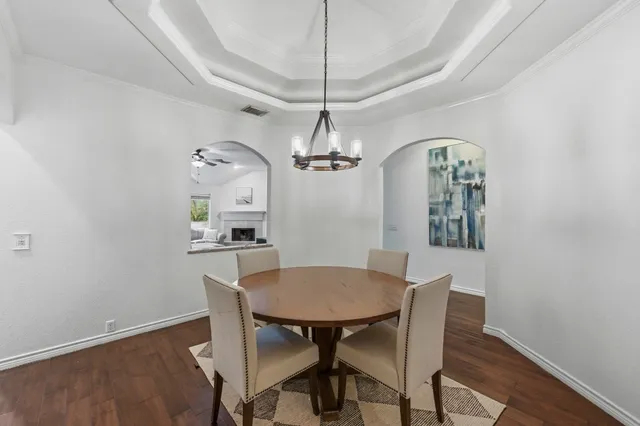 a dining room with a table and chairs