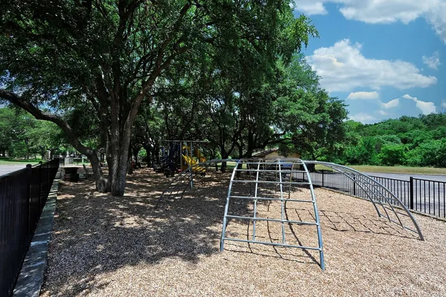 a view of a backyard with sitting area