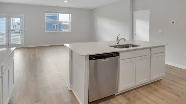 a kitchen with a sink and cabinets