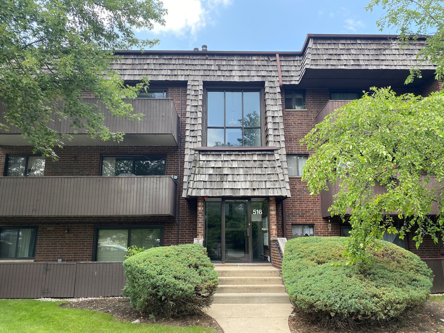 516 Timber Ridge Drive, Unit 206B Carol Stream, IL 60188 - Photo 1 of 20 an aerial view of a house with garden