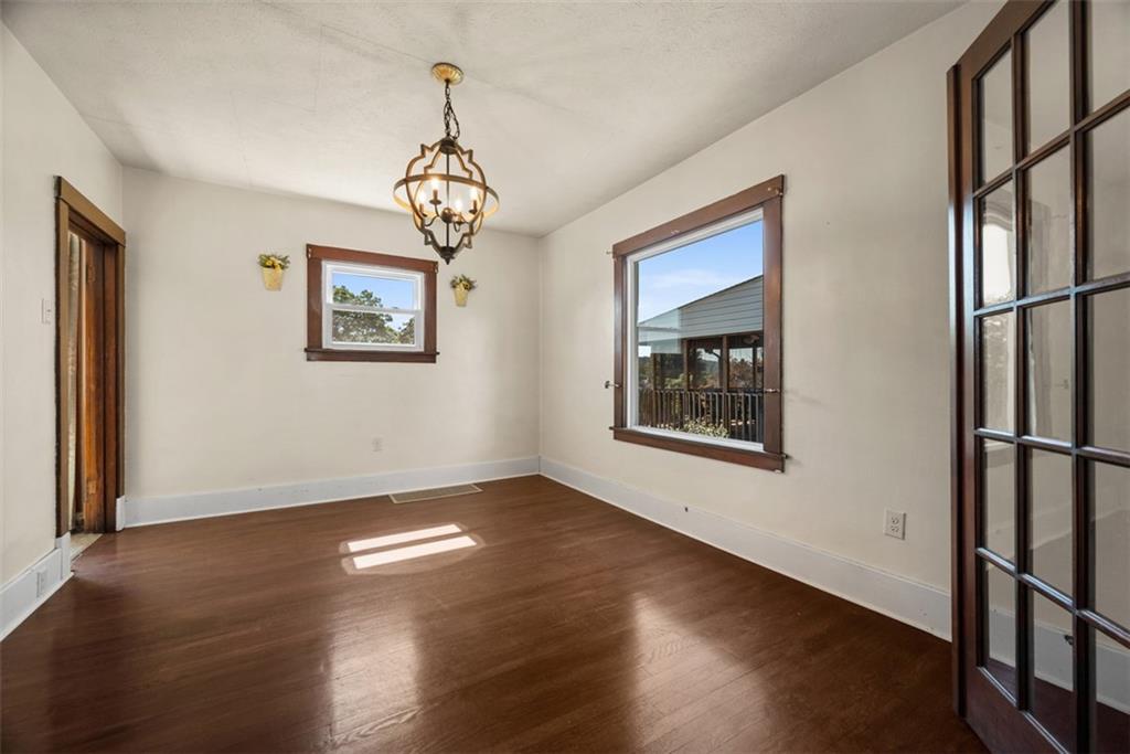 745 6th Street Beaver, PA 15009 - Photo 11 of 36 a view of an empty room with wooden floor and a window