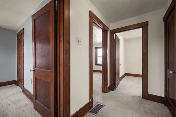 a view of hallway with livingroom