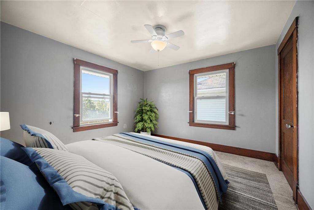 745 6th Street Beaver, PA 15009 - Photo 18 of 36 a bedroom with a large bed and a window