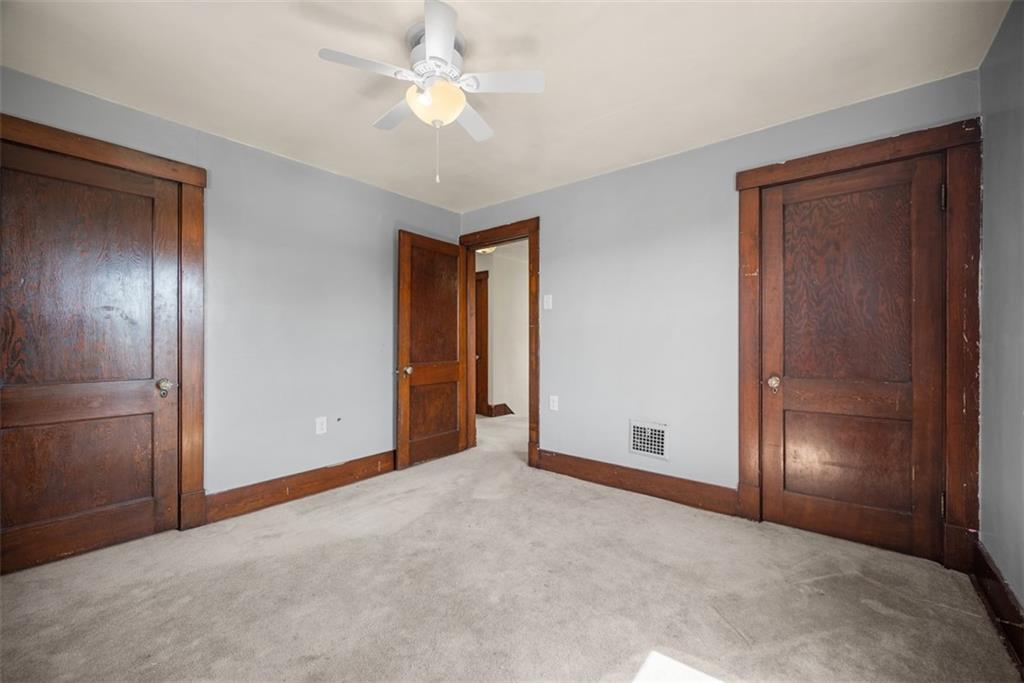 745 6th Street Beaver, PA 15009 - Photo 19 of 36 an empty room with closet and a ceiling fan