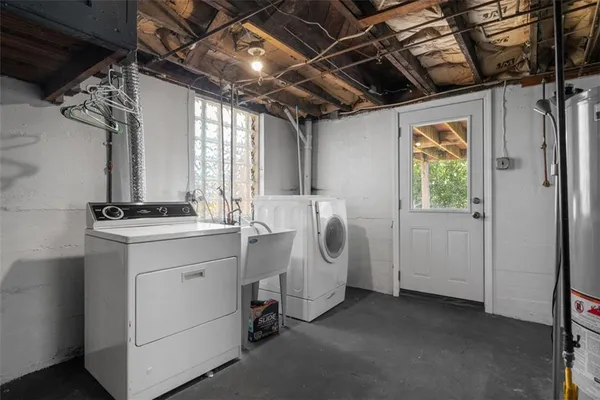 a utility room with dryer and washer