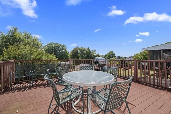 a view of a chairs and table in patio
