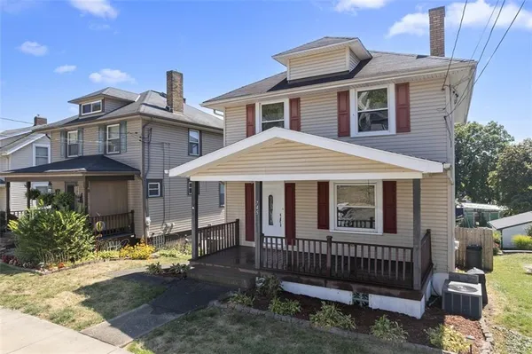 a front view of a house with a porch