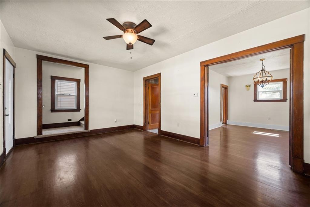 745 6th Street Beaver, PA 15009 - Photo 9 of 36 a view of a livingroom with wooden floor and a ceiling fan