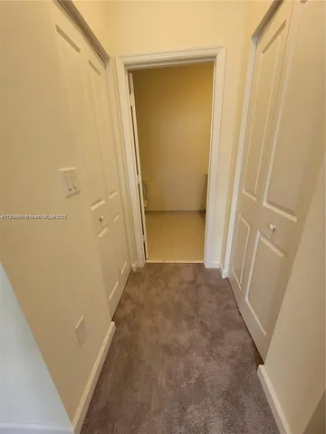 a bathroom with a double vanity sink and mirror