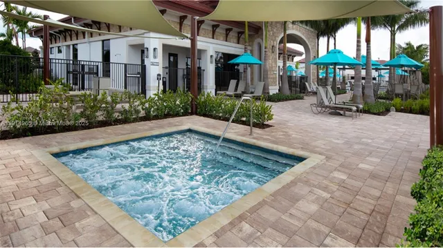 a swimming pool with outdoor seating and yard