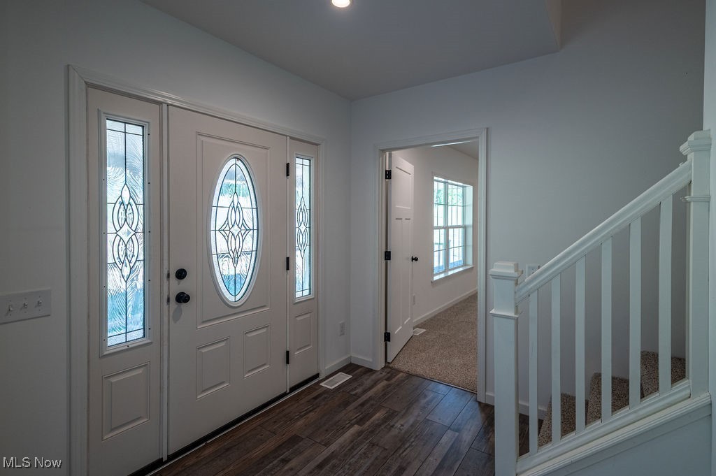 7343 Lost Pavement Road Belleville, WV 26133 - Photo 3 of 49 Foyer featuring dark wood finished floors, stairs, and recessed lighting