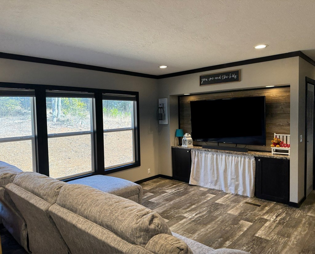 35 Bergan Moore Road Murphy, NC 28906 - Photo 2 of 18 a bedroom with a bed and a flat screen tv