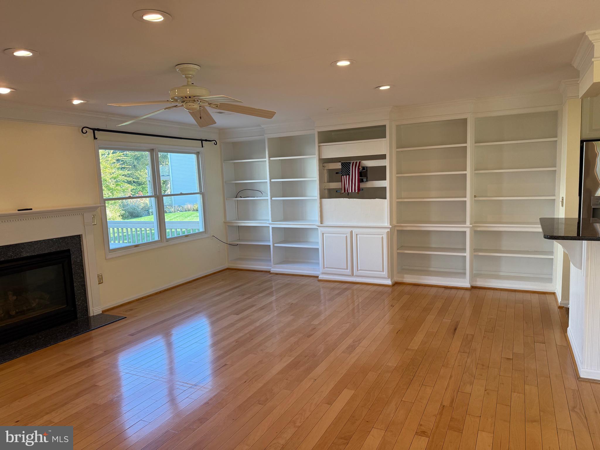 807 Auckland Way Chester, MD 21619 - Photo 11 of 42 a view of an empty room with a window and wooden floor