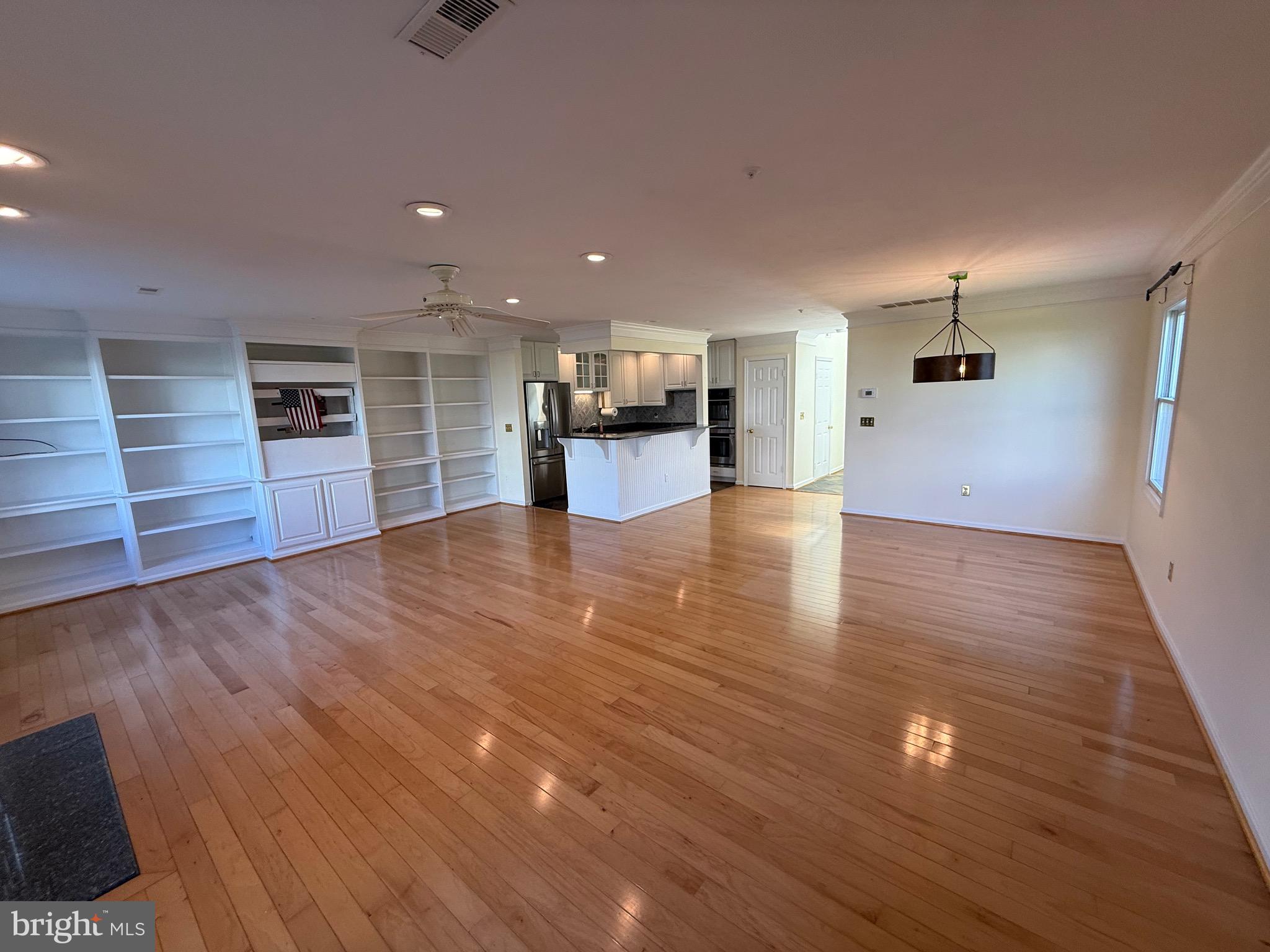 807 Auckland Way Chester, MD 21619 - Photo 14 of 42 a view of a livingroom with wooden floor