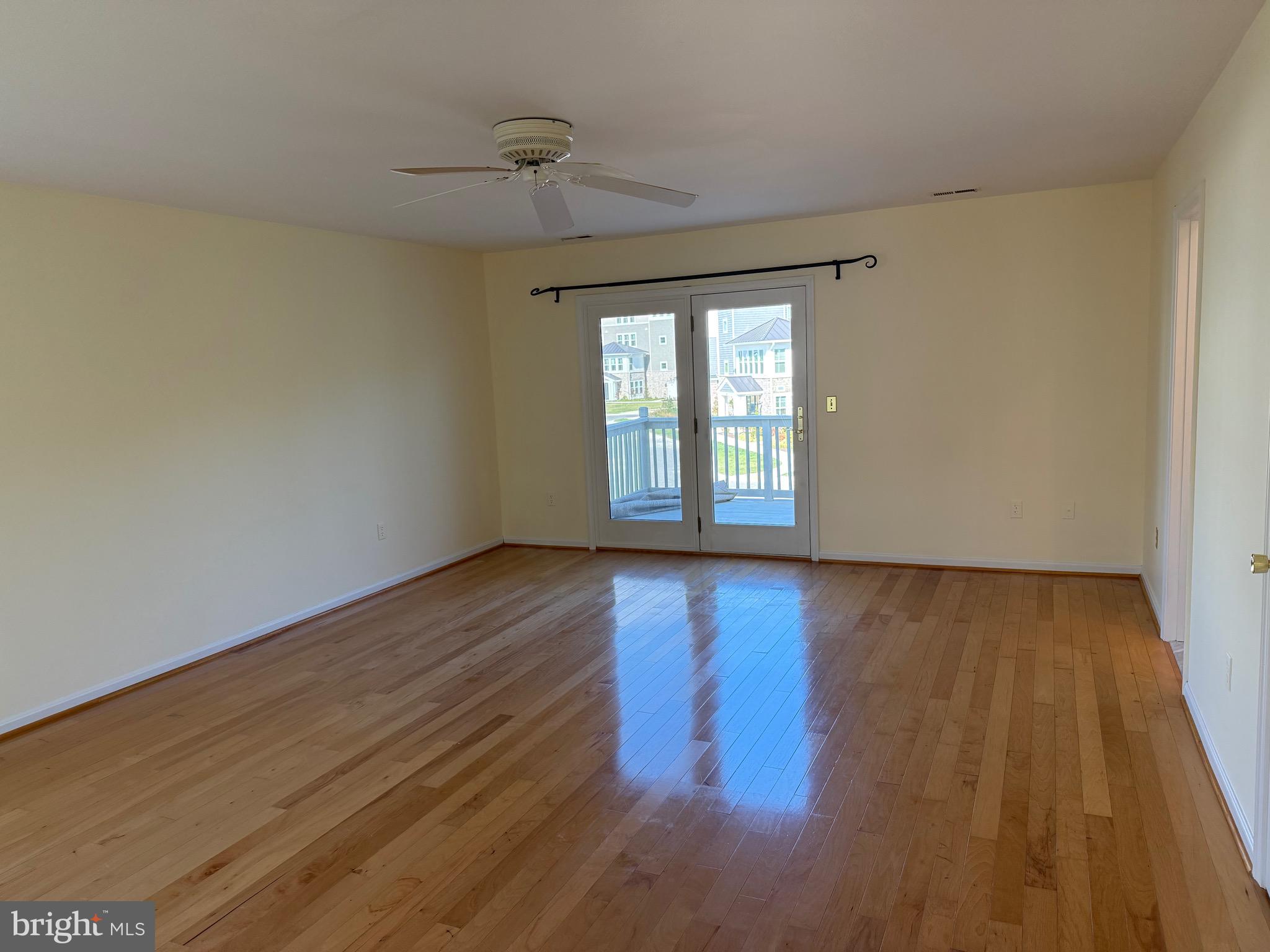 807 Auckland Way Chester, MD 21619 - Photo 19 of 42 a view of an empty room with wooden floor and a window