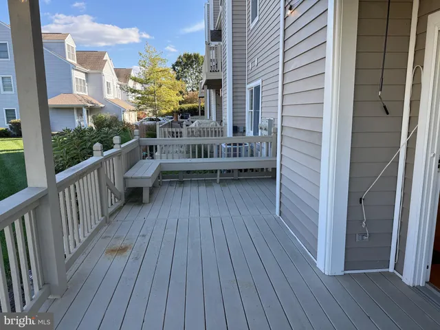 a view of a balcony with wooden floor