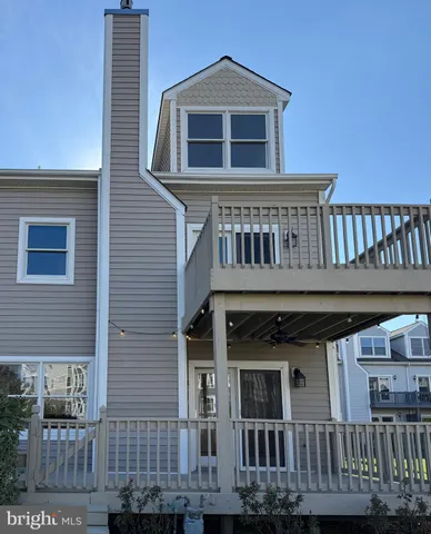 a view of a house with wooden deck