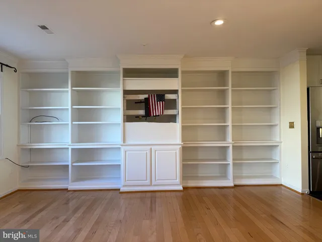 a view of a room with wooden floor and closet