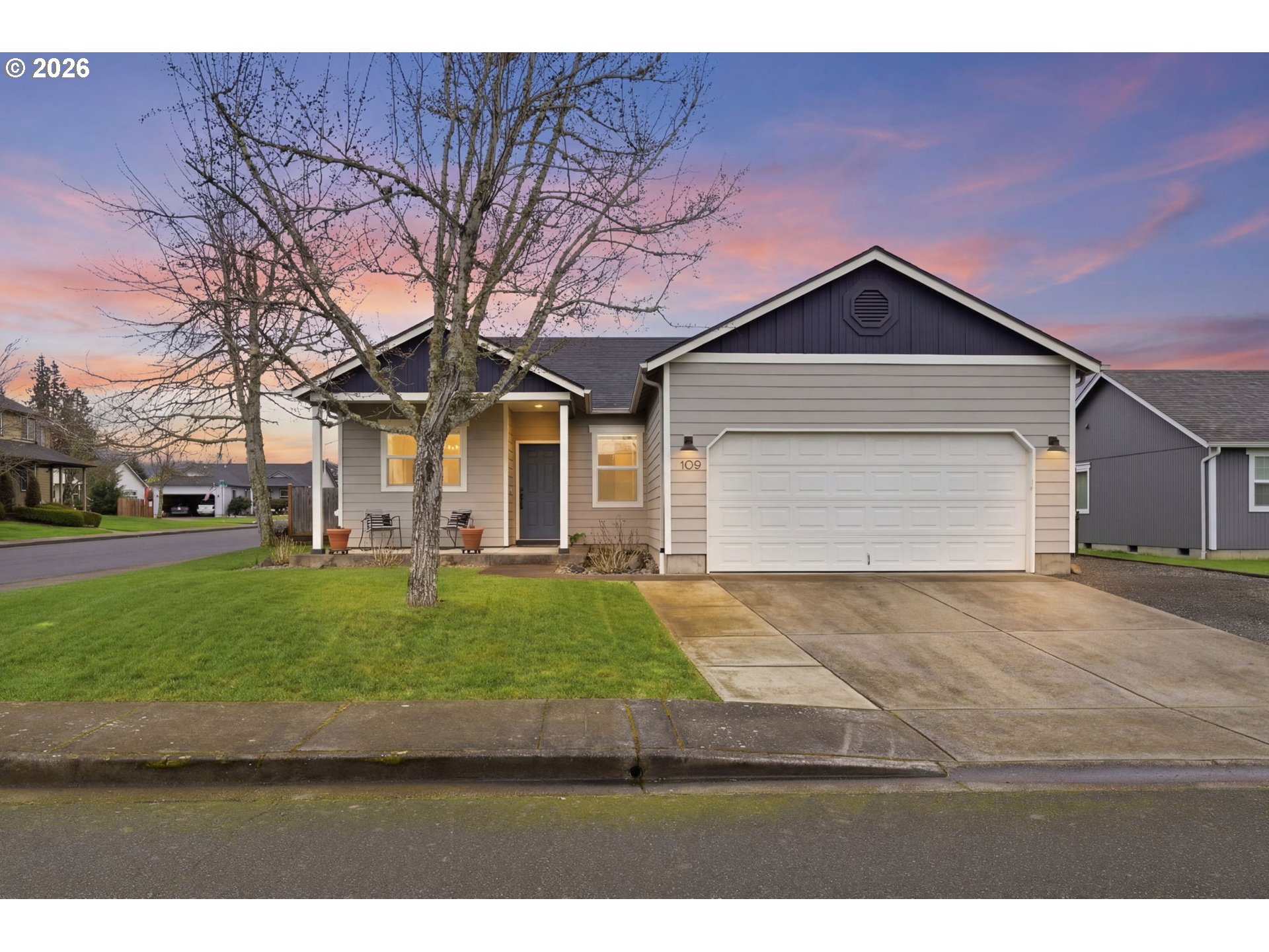 a front view of a house with a yard