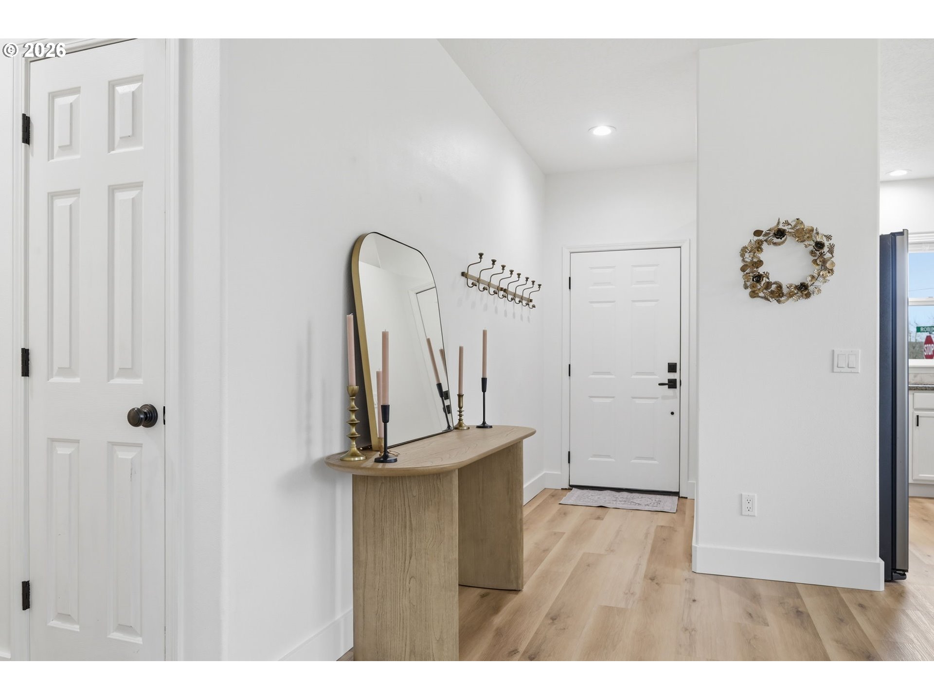 109 Robin Court Creswell, OR 97426 - Photo 3 of 29 a view of a room with wooden floor and white walls
