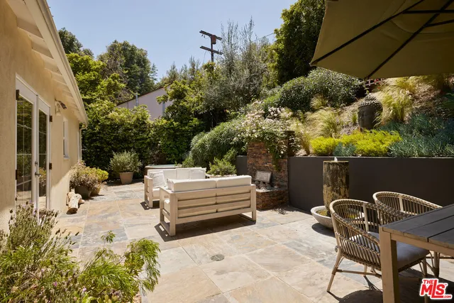 a view of backyard with sitting area