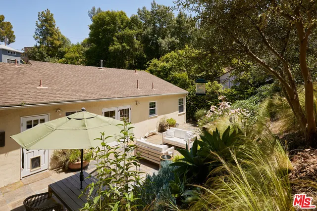 a aerial view of a house with swimming pool and porch