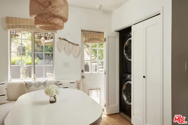 a bathroom with a sink a mirror and a window