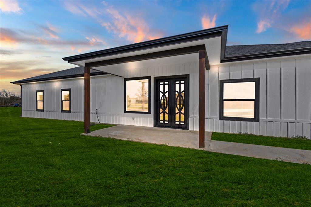 1706 County Road Sumner, TX 75486 - Photo 28 of 28 a view of an house with backyard and porch