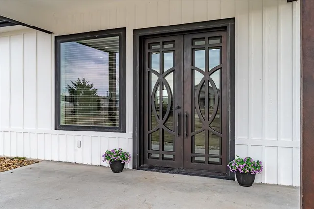a view of a entryway door front of a house