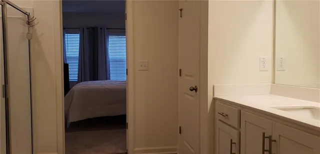 a bathroom with a glass shower door