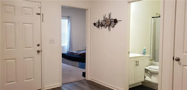 a white toilet sitting next to a bathroom sink
