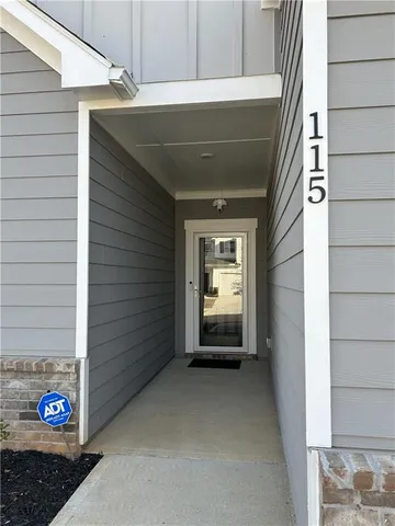 a view of a livingroom with furniture and hardwood floor