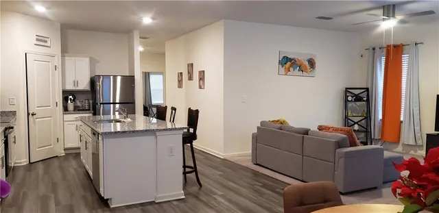 a kitchen with a refrigerator stove and microwave