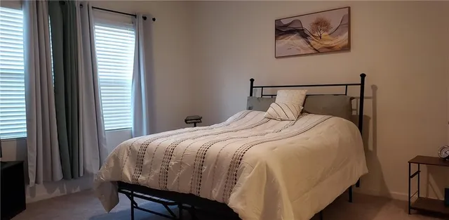 a bathroom with a double vanity sink and mirror